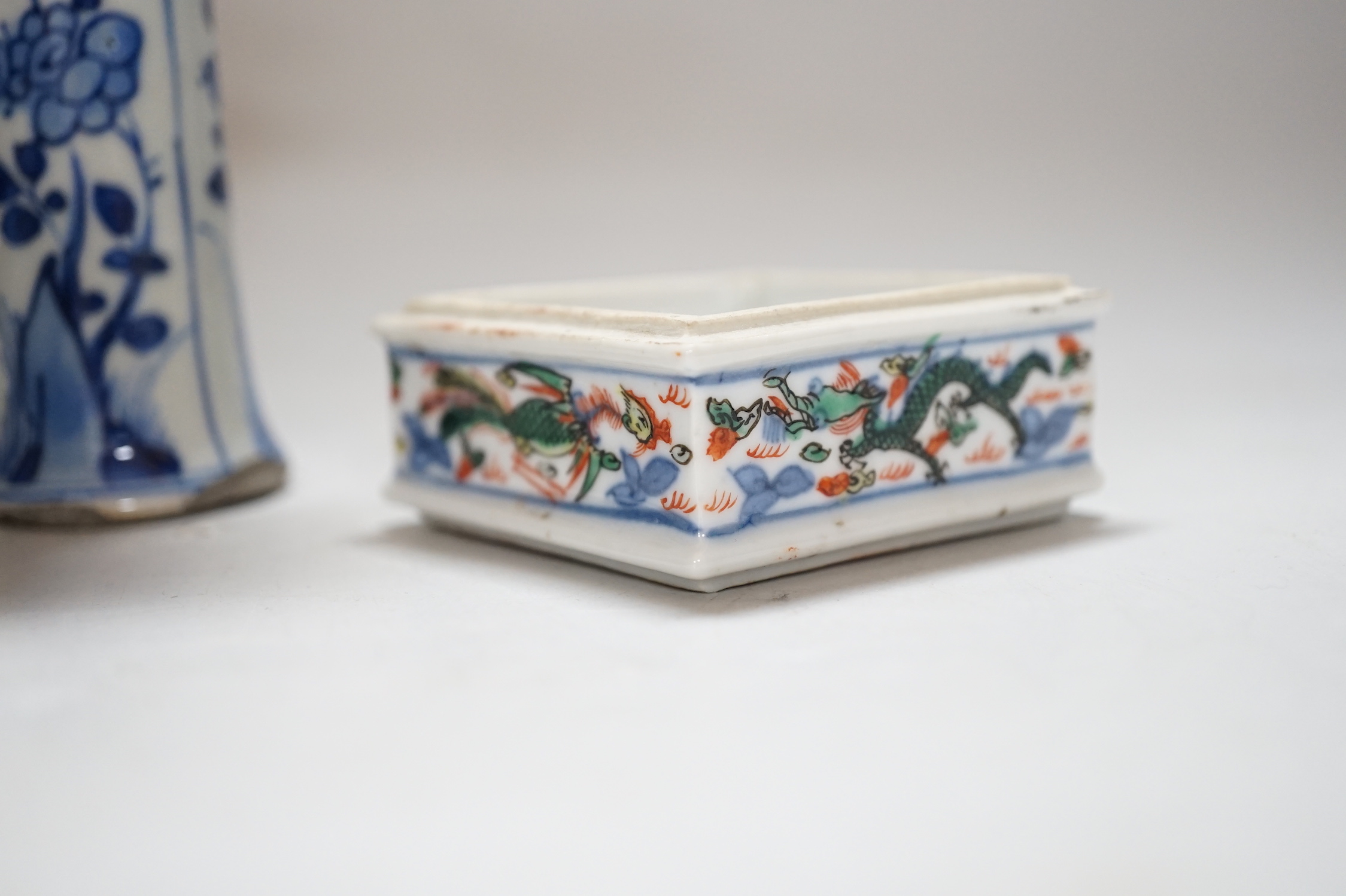 Three Chinese blue and white vases and a wucai square box, one with inscription, 18th century and later, tallest 14cm high